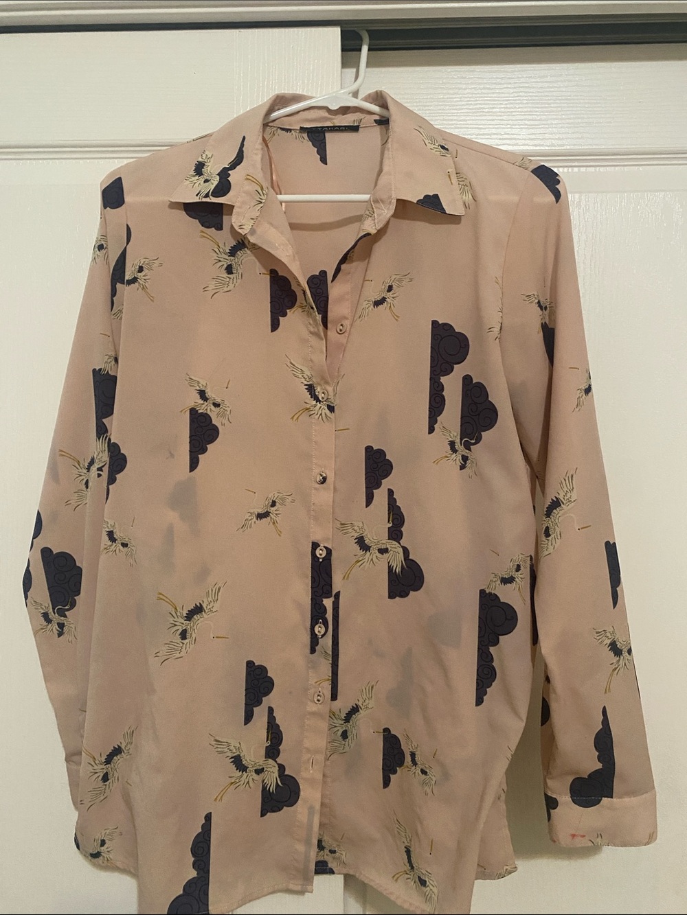 Beautiful and flowy Tahari blouse with cranes and clouds.
